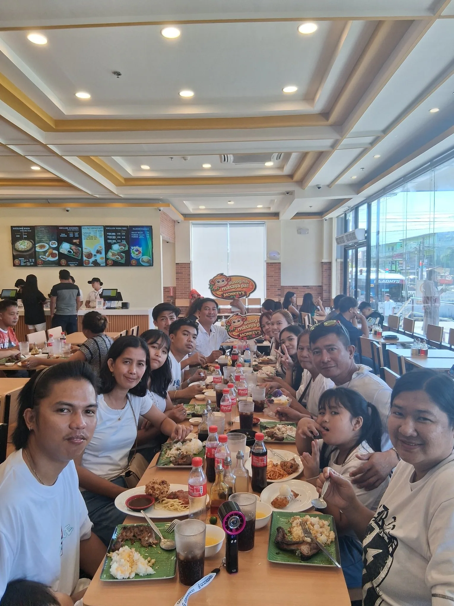 Large family group dining at Monkey's Resto Calapan