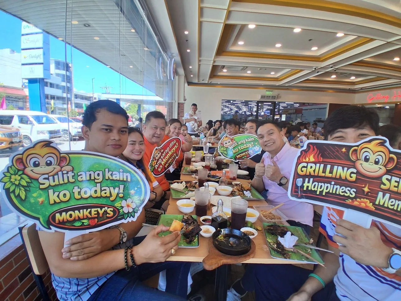 Group of friends dining at Monkey's Resto