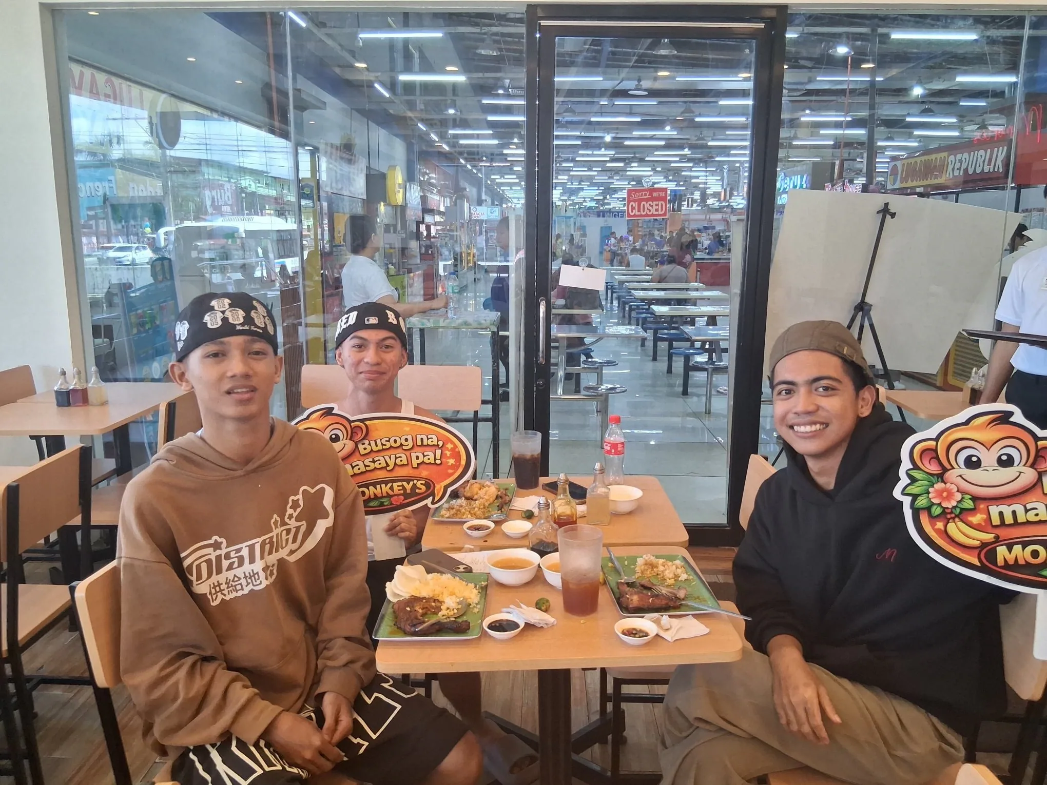 Three friends dining at Monkey's Resto