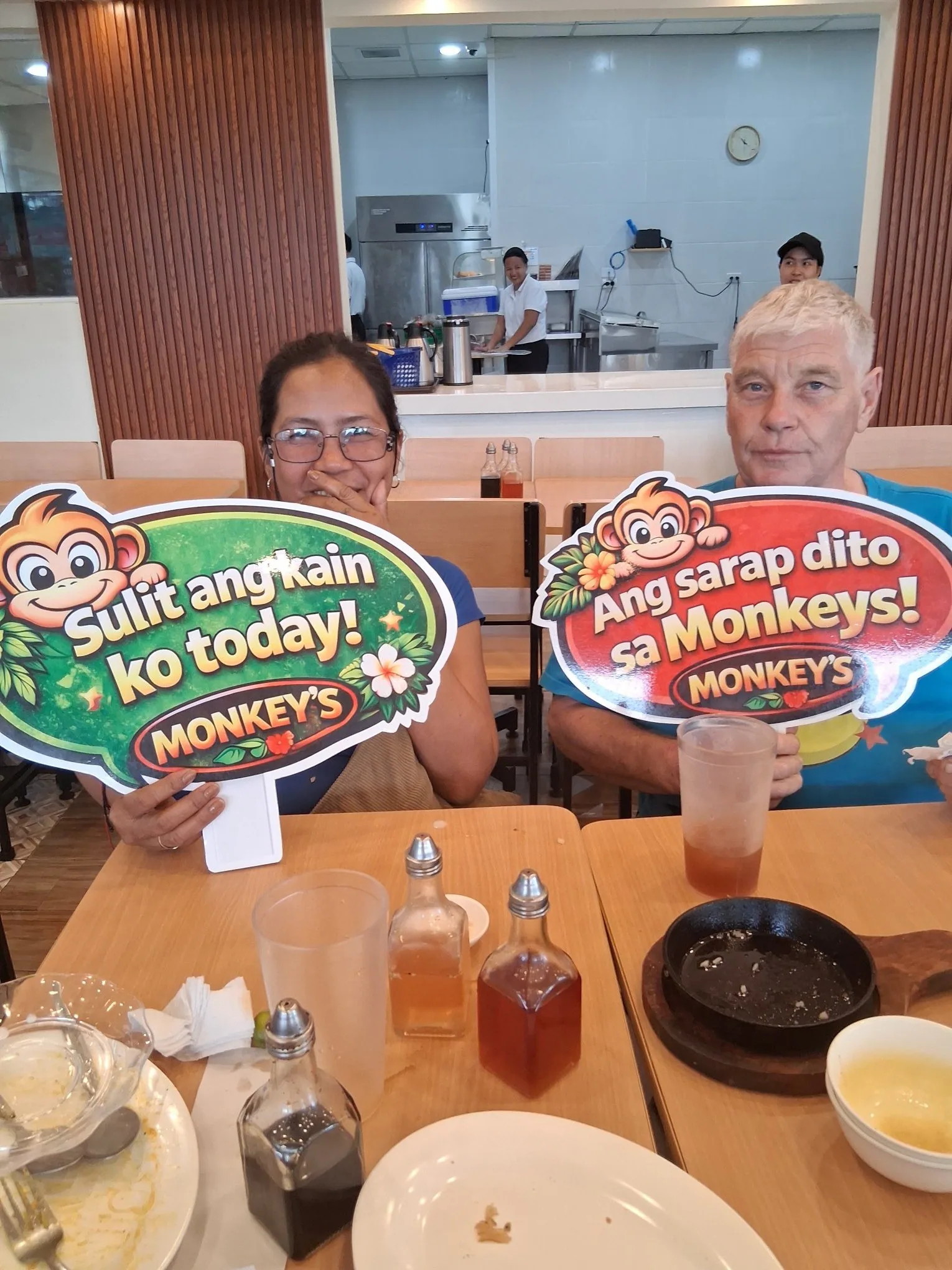 Happy couple dining at Monkey's Resto