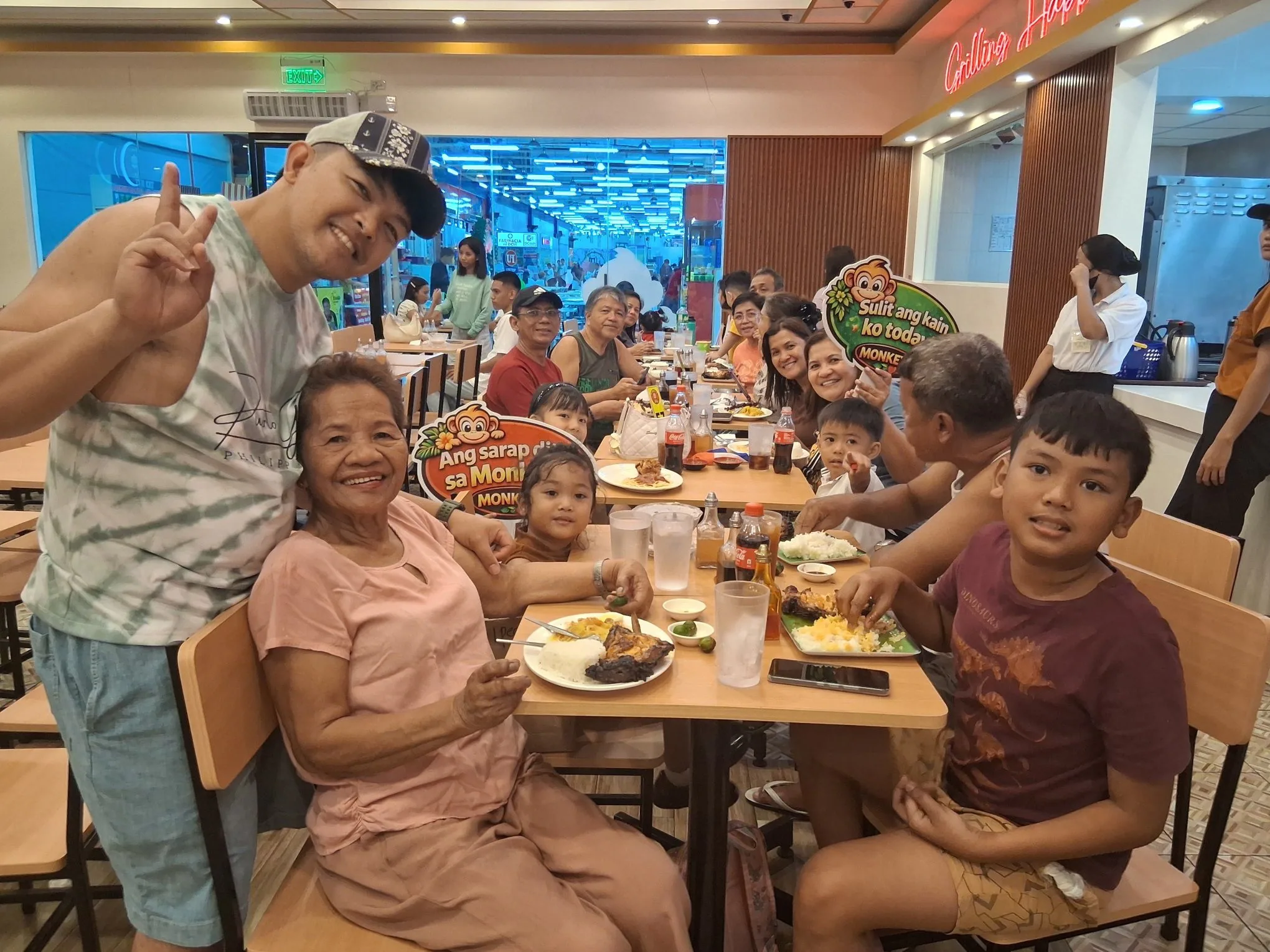 Large family enjoying dinner at Monkey's Resto