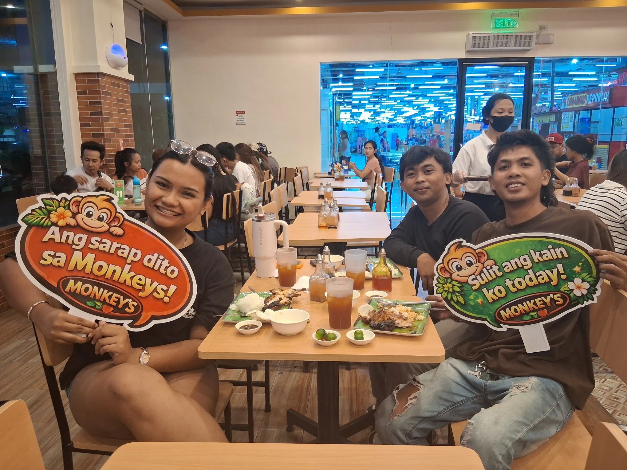 Friends dining at Monkey's Resto in the evening